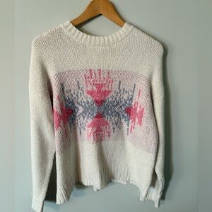 Reitman’s cozy pink and blue patterned soft knit sweater